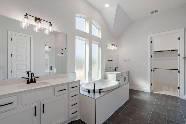 Primary Bath retreat with dual vanities & garden tub | Image 19