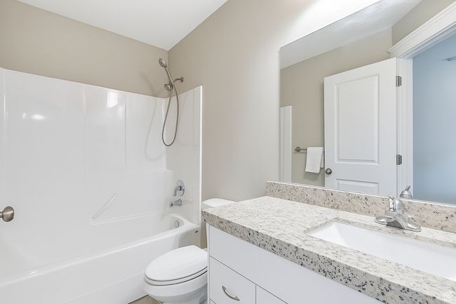 Full bathroom with vanity and bathing tub / shower combination | Image 11