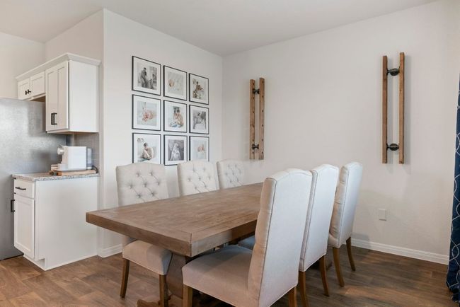 Dining area with dark wood-style flooring | Image 9