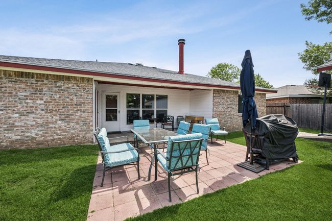 Open patio with space for a table and a grill | Image 23
