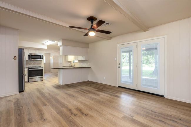 Dinning room has French door that leads out into the back yard | Image 11