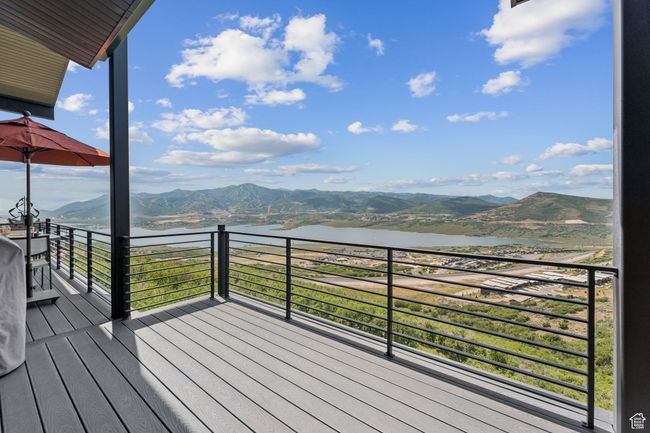 Wooden deck featuring a water and mountain view | Image 51