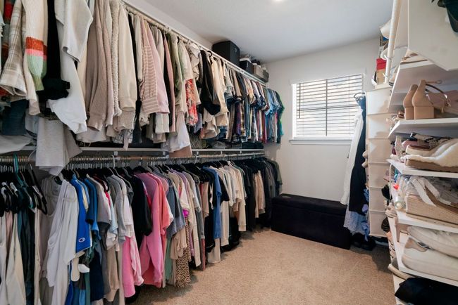Spacious closet with carpet | Image 23