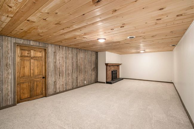 Finshed Rec-Room with wood burning Fireplace in Basement. | Image 30