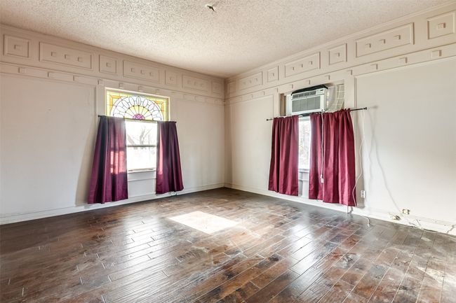 Look at the stained glass & molding detail-this room has tons of potential | Image 8