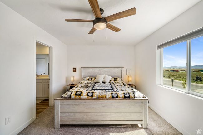 Carpeted bedroom featuring baseboards and a ceiling fan | Image 19