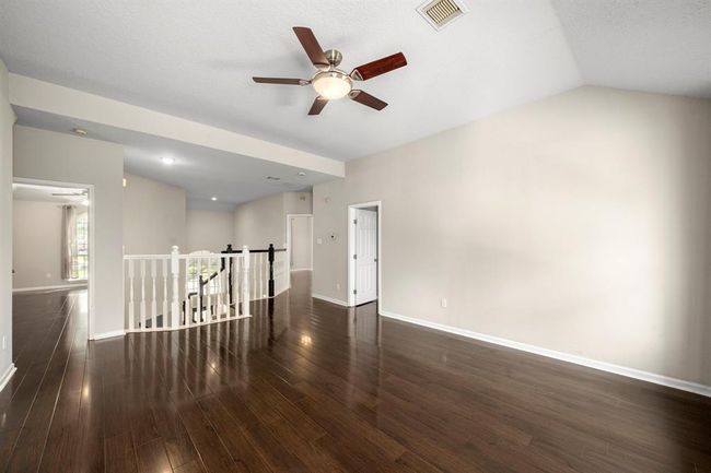 Wood floors continue to the second floor. | Image 27
