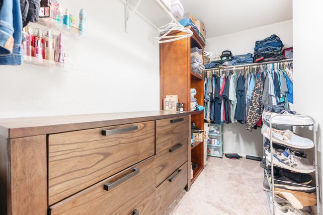 Walk in closet with carpet flooring | Image 9