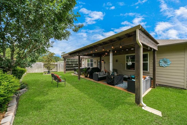 Beautifully landscaped backyard backs to greenspace. Spa goes with the house! | Image 4