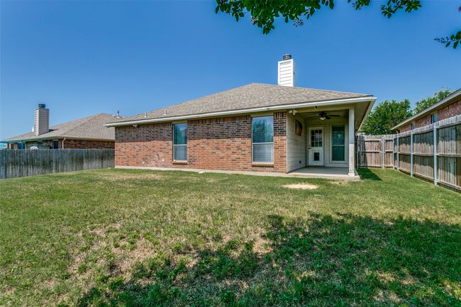 This backyard is spacious, fully fenced and private, making it the perfect place for relaxing or entertaining. | Image 33