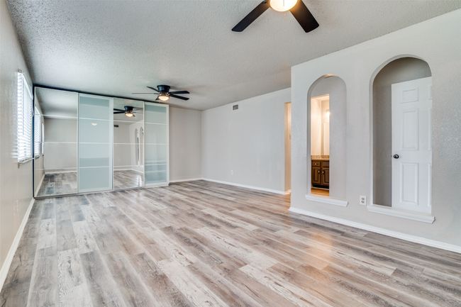 Unfurnished room featuring ceiling fan, a textured ceiling, and light wood-type flooring | Image 21