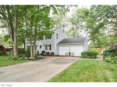 View of front of house featuring a garage and a front yard | Image 2