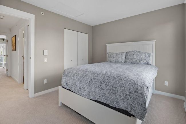 Bedroom with light carpet, a closet, baseboards, and attic access | Image 29