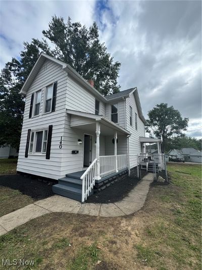 View of front of house with a front yard and a porch | Image 2