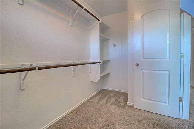 Walk in closet with carpet floors | Image 30