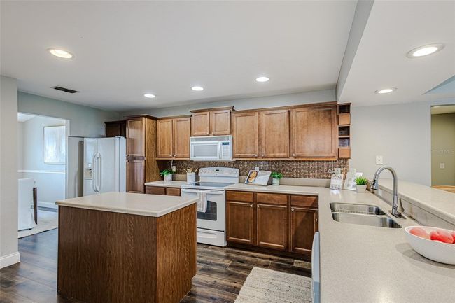 The kitchen is connected to the family room | Image 35