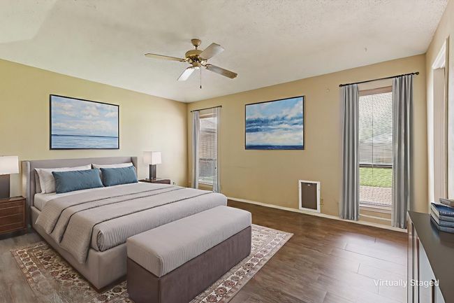 Bedroom with dark wood-type flooring, ceiling fan, and a textured ceiling | Image 17