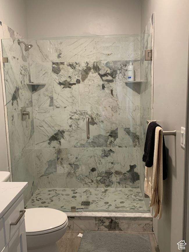 Full bath with vanity, a shower stall, and toilet | Image 13