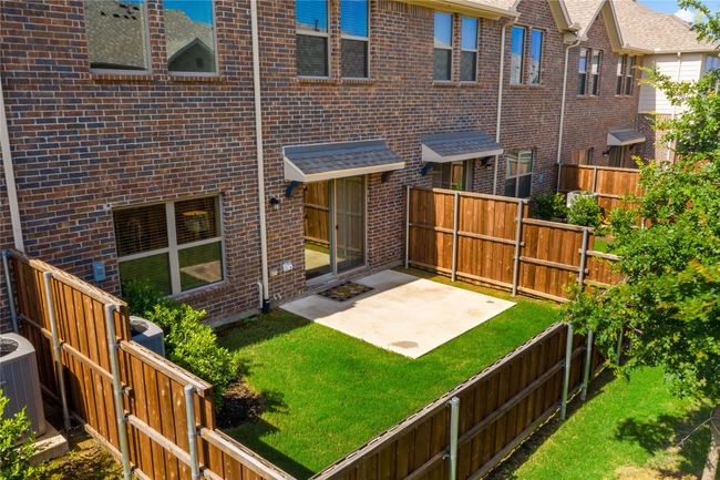 Back of house with a yard, cooling unit, and a patio | Image 22