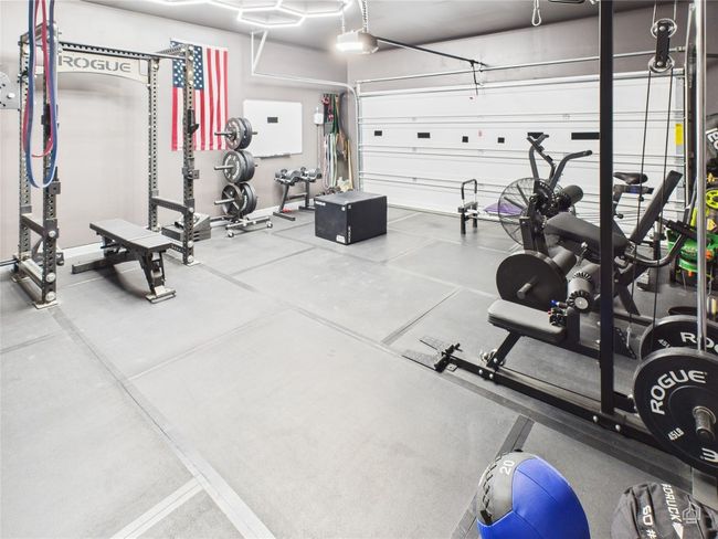 Workout area featuring a garage | Image 29