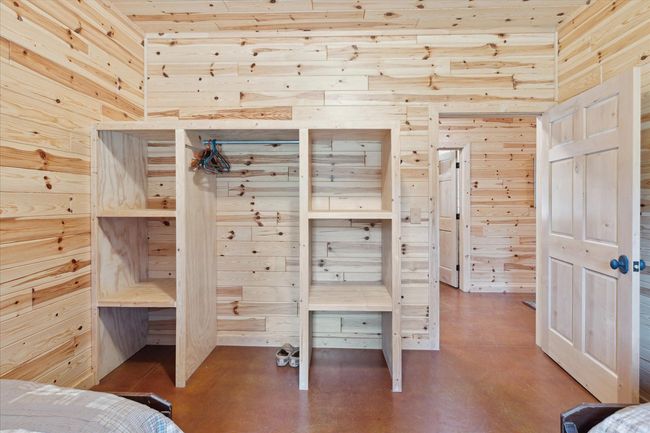 Bedroom #1 with shelves and closet. | Image 24