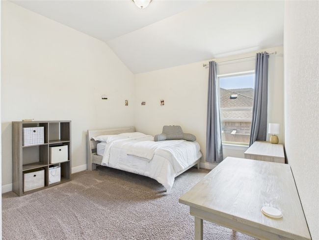 Carpeted bedroom with baseboards and vaulted ceiling | Image 15