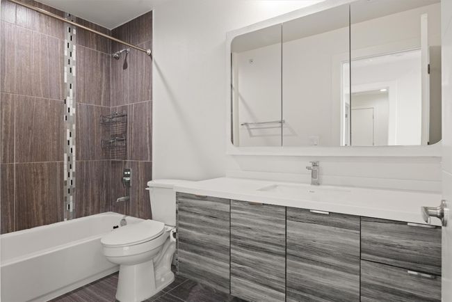 Full bath featuring vanity and tub / shower combination | Image 23