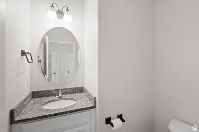 Bathroom with toilet and vanity | Image 16