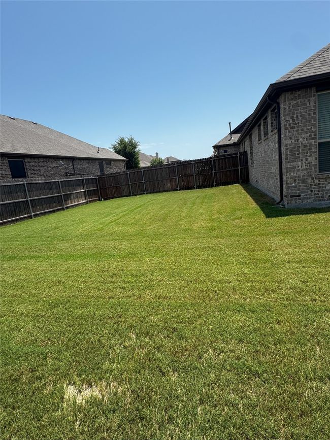 View of fenced backyard | Image 30