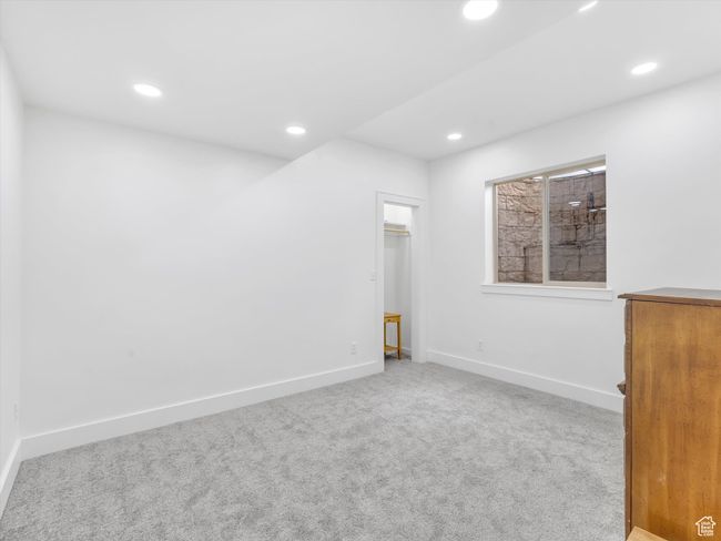 Empty room with recessed lighting, carpet floors, and baseboards | Image 36