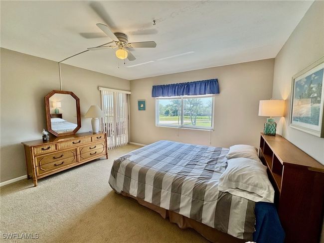 primary bedroom with beautiful golf course views | Image 15