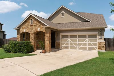 Double wide driveway with 2-car garage. | Image 3