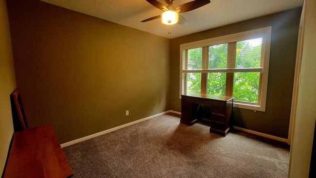 Second main floor bedroom with large newer window | Image 10