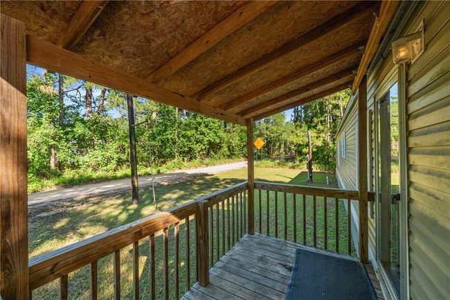 Wooden deck with a lawn | Image 29