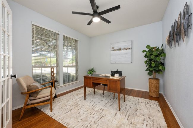 Home office with ceiling fan, wood finished floors, and baseboards | Image 17