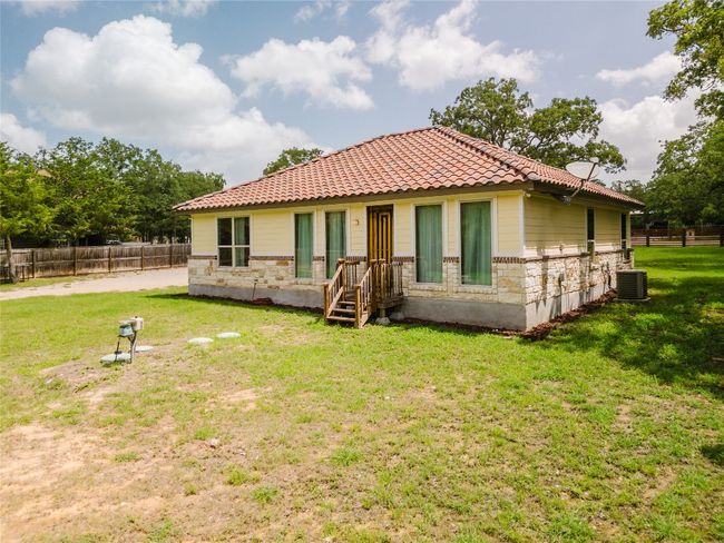 Back of house featuring a tiled roof | Image 7