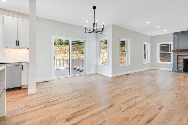 Empty room featuring light wood finished floors and ornamental molding | Image 14