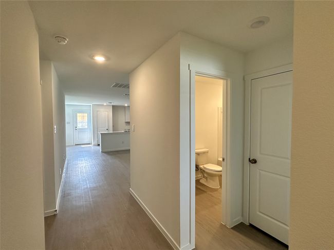 Corridor featuring dark wood finished floors | Image 9