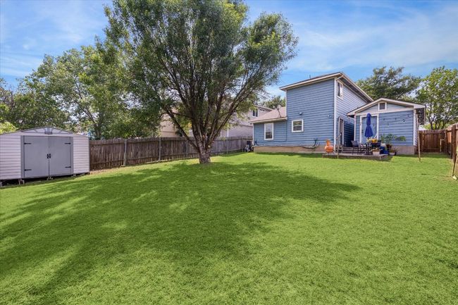 sizeable backyard with storage shed | Image 24