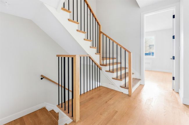 Stairway with hardwood / wood-style flooring | Image 16