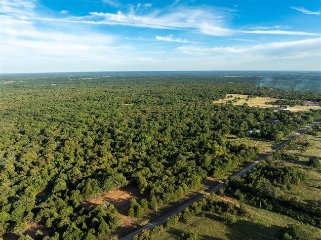 Birds eye view of property with a forest view | Image 16