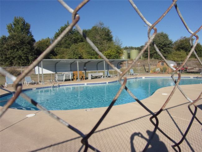 Pool with a patio area | Image 11