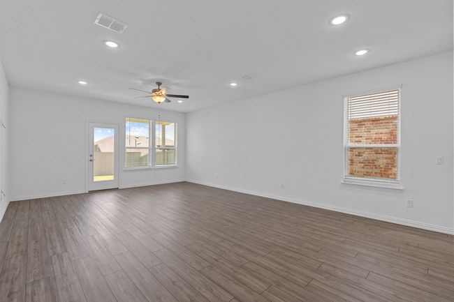 Spare room featuring ceiling fan, dark wood-type flooring, and recessed lighting | Image 4