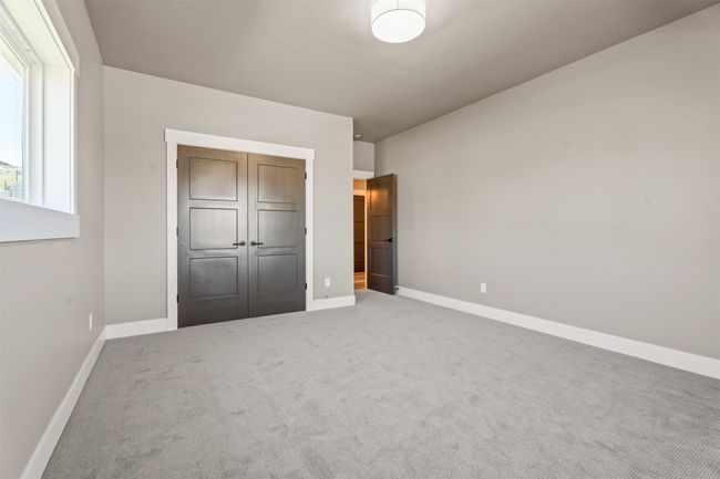 Unfurnished bedroom featuring baseboards and carpet | Image 27
