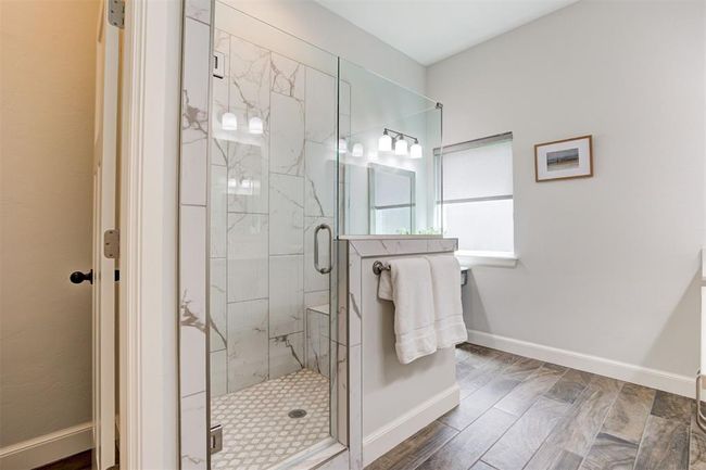 Primary bathroom with large walk-in shower. | Image 16