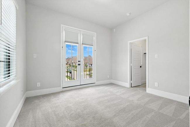 Spare room featuring french doors and carpet | Image 32