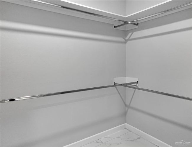 Spacious closet with marble finish floor | Image 16