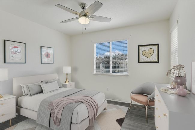 Virtually Staged Bedroom with wood finished floors and ceiling fan | Image 7