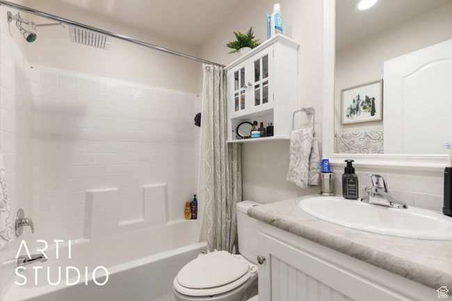Full bath featuring shower / tub combo, vanity, and recessed lighting | Image 16