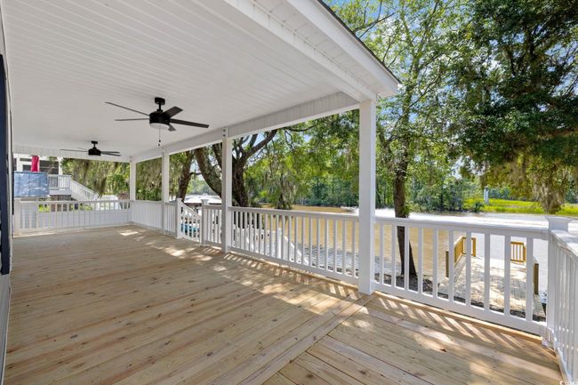 Wooden deck featuring ceiling fan | Image 29